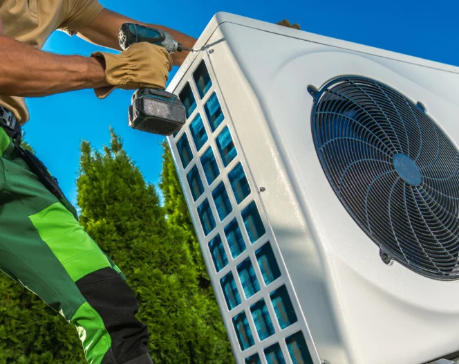 hvac technician opening the cover of heat pump 1